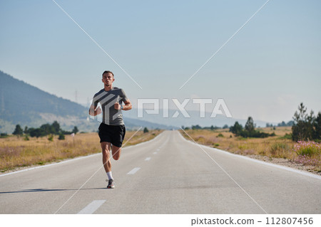 A dedicated marathon runner pushes himself to the limit in training. 112807456