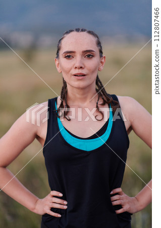Close-Up Portrait of Determined Athlete Resting After Intense Workout 112807466