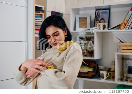 Beautiful Woman Posing with Her Two Adorable Bearded Dragon Pets Beautiful Woman Posing with Her Two Adorable Bearded Dragon Pets 112807790