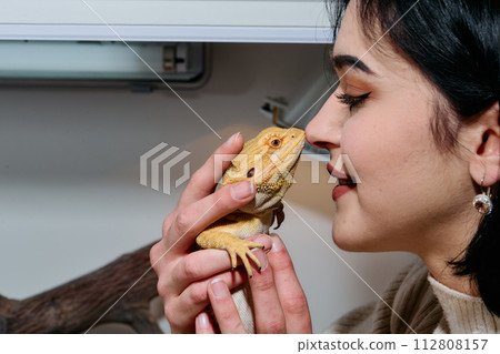 Beautiful Woman Kissing Bearded Dragon Pets Beautiful Woman Kissing Bearded Dragon Pets 112808157