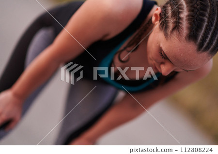 Close-Up Portrait of Determined Athlete Resting After Intense Workout 112808224