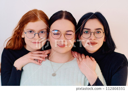 Sisters United: A Portrait of Family Love and Bonding on White Background Sisters United: A Portrait of Family Love and Bonding on White Background 112808331