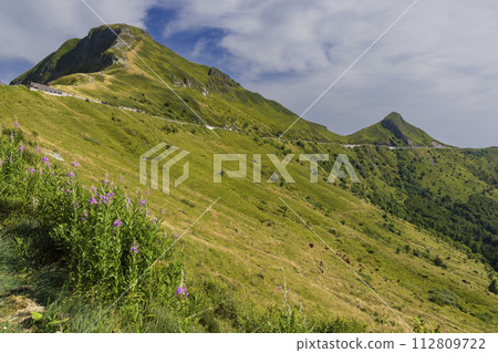 Puy Mary (1783 m) with road, Cantal, Auvergne-Rhone-Alpes region, France Puy Mary (1783 m) with road, Cantal, Auvergne-Rhone-Alpes region, France 112809722