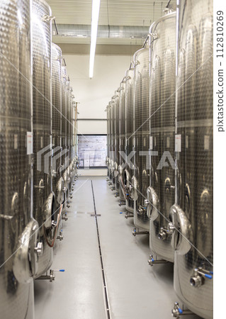 Modern production wine cellar with stainless steel tank, Southern Moravia, Czech Republic Modern production wine cellar with stainless steel tank, Southern Moravia, Czech Republic 112810269