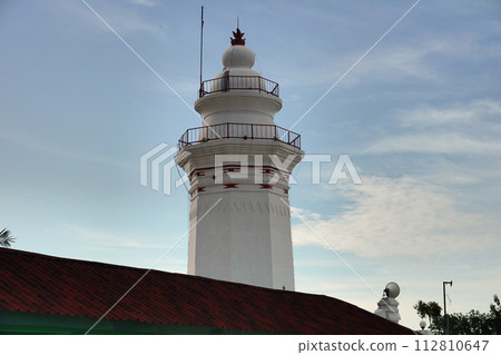 Photo of the white banten royal tower object, with a blue sky background Photo of the white banten royal tower object, with a blue sky background 112810647