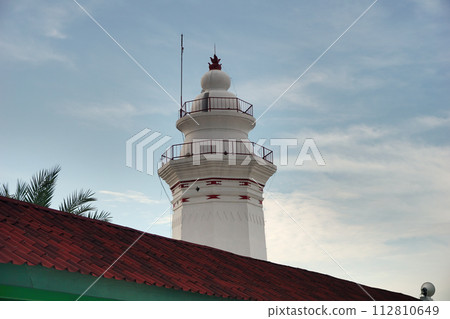 Photo of the white banten royal tower object, with a blue sky background Photo of the white banten royal tower object, with a blue sky background 112810649