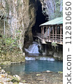 Landscape with a cave 112810650