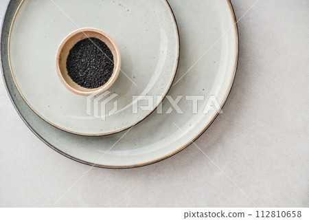 Two plates of different sizes and tiny bowl Two plates of different sizes and tiny bowl 112810658