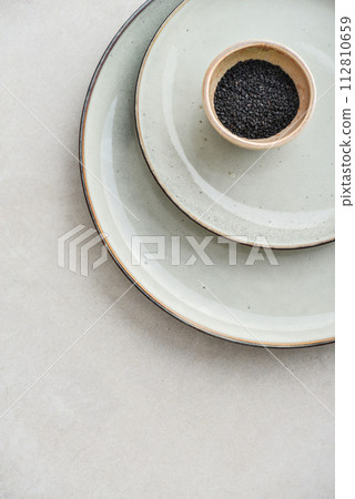 Two plates of different sizes and tiny bowl Two plates of different sizes and tiny bowl 112810659