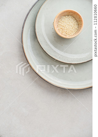Two plates of different sizes and tiny bowl Two plates of different sizes and tiny bowl 112810660