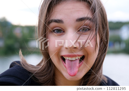 typical teenager girl mock gesture. High quality photo typical teenager girl mock gesture. High quality photo 112811295