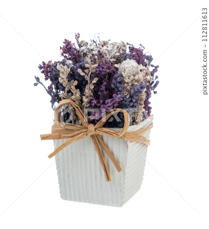 Artificial flowers in a vase of lavender and lavender flowers isolated on a white background. Artificial flowers in a vase of lavender and lavender flowers isolated on a white background. 112811613
