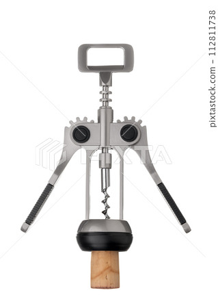 Corkscrew opener with cork screwed in on a white insulated background. Corkscrew opener with cork screwed in on a white insulated background. 112811738