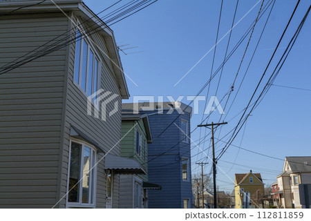 Old residential houses in a row in the Wallington New Jersey, With wires hanging from poles 112811859