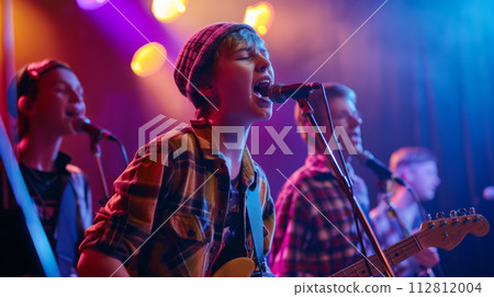 Young Boy Band Performing on Stage 112812004