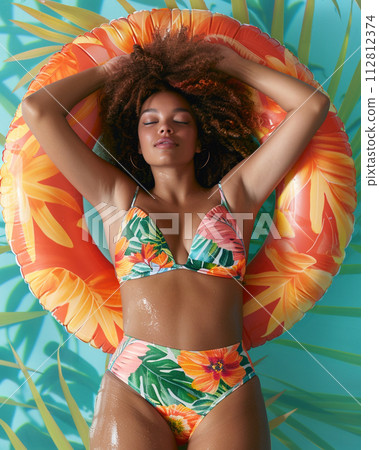 Attractive Woman Enjoying Summer in Pool  112812374