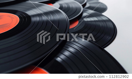 Vintage vinyl records, carefully arranged in a spiral pattern, evoke a sense of nostalgia Vintage vinyl records, carefully arranged in a spiral pattern, evoke a sense of nostalgia 112812902