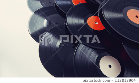 Vintage vinyl records, carefully arranged in a spiral pattern, evoke a sense of nostalgia 112812904