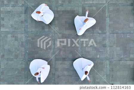 Mevlevi. Sufis spinning outdoors.Spinning Dervish Mevlevi. Sufis spinning outdoors.Spinning Dervish 112814163