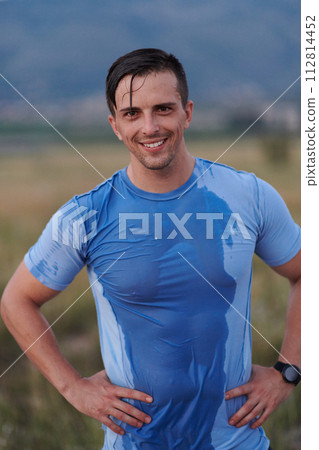 Post-Run Repose: Sweaty Athlete Rests After Intense Daily Run. 112814452