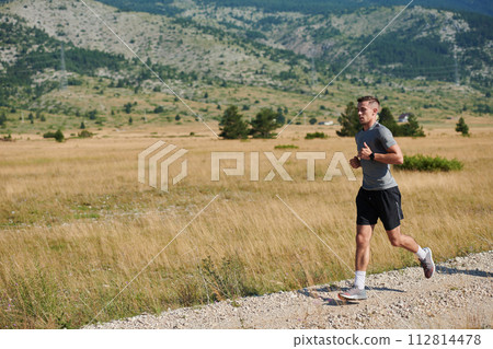 A dedicated marathon runner pushes himself to the limit in training. 112814478