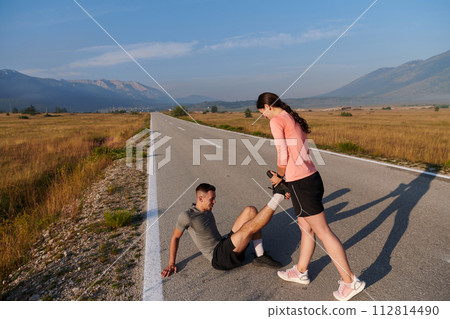 Morning Stretch: Romantic Couple Prepares for Early Morning Run Morning Stretch: Romantic Couple Prepares for Early Morning Run 112814490