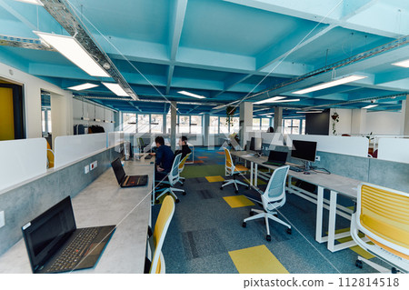 Photo of a modern office where programming, digital marketing and web design projects are done. Office with modern furniture and glass office 112814518