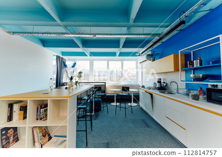 Photo of a modern office where programming, digital marketing and web design projects are done. Office with modern furniture and glass office 112814757