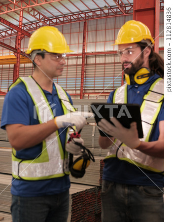 Team of engineers working at the factory 112814836