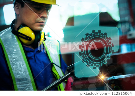 Team of engineers working at the factory 112815004