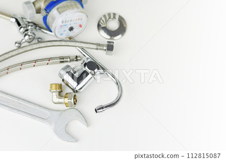 Plumbing parts, accessories and tools on a white background with copy space. 112815087
