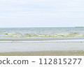 Green dark sea water wave natural phenomenon with brown sand beach. Seawater in Bang Saen, Chonburi Province, has turned green. Natural phenomenon. During rainy season called Plankton bloom 112815277