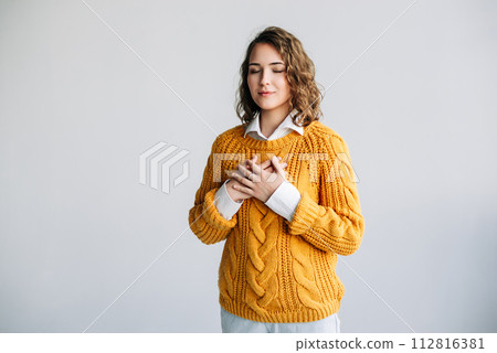 Grateful Woman: Hands on Chest, Expressing Happiness, Mental Balance - Thankfulness, Kindness, Love 112816381