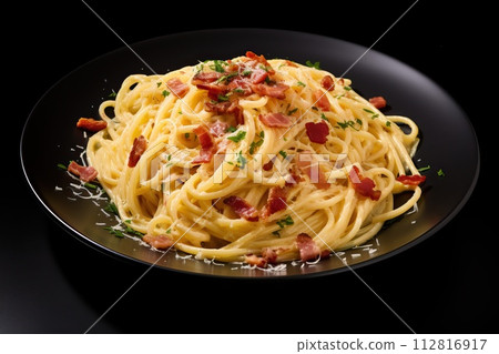 Spaghetti carbonara with bacon and parmesan on black background 112816917