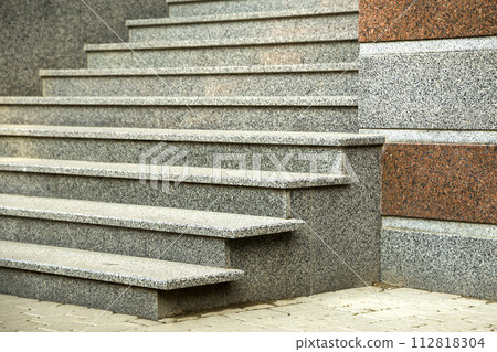 Detail of a house facade. New granite stairs. 112818304