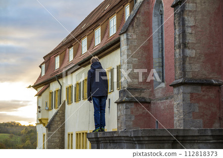 Little boy standing in old town enjoying view Little boy standing in old town enjoying view 112818373