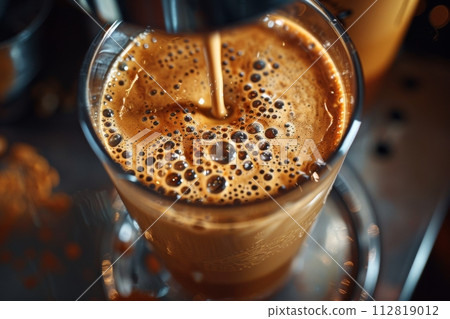 AI-generated content. Bulletproof coffee blending in a glass mug with dynamic swirls and bubbles 112819012