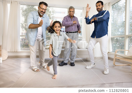 Indian kid, dad, grandpa and great granddad dancing to music Indian kid, dad, grandpa and great granddad dancing to music 112820801