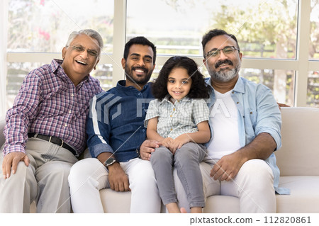 Cheerful kid and men of four family generations sitting close 112820861