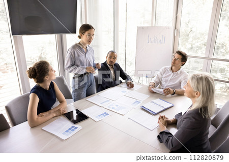 Businesspeople take part in morning briefing conduct by millennial teammate 112820879