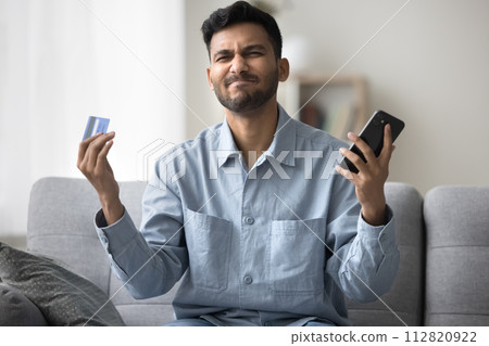 Man having problems with e-payment, scam or failed transaction 112820922