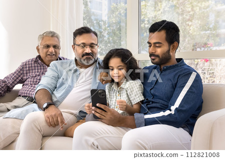 Indian relatives of four different family generations using online application 112821008
