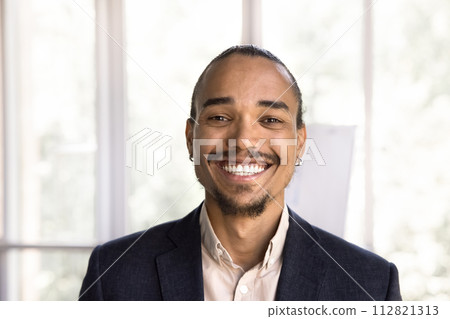 Head shot portrait African businessman posing in office 112821313