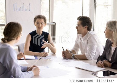 Young and ambitious businesspeople take part in group meeting 112821337