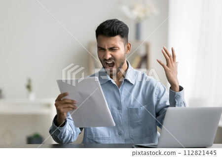 Angry Indian man read bad news in paper correspondence Angry Indian man read bad news in paper correspondence 112821445