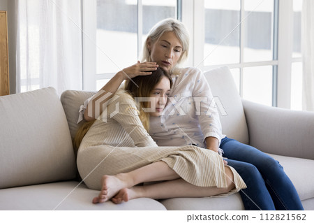 Loving mum give emotional support stroking her frustrated preteen daughter 112821562