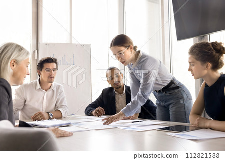 Team discussing business ideas, share sales results, planning strategy 112821588