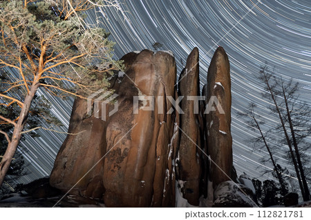 Majestic Rock Formation Silhouetted Against a Starry Night Sky Majestic Rock Formation Silhouetted Against a Starry Night Sky 112821781