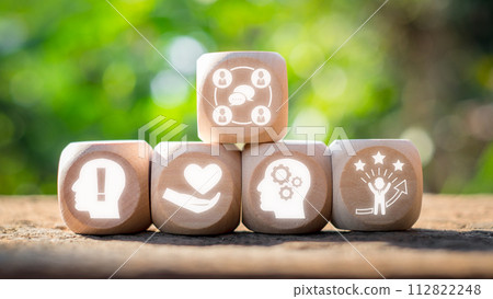 Emotional intelligence concept, Wooden block on desk with emotional intelligence icon on virtual screen. 112822248