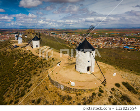 Aerial view of Wind mills at knolls at Consuegra, Toledo region Aerial view of Wind mills at knolls at Consuegra, Toledo region 112822554
